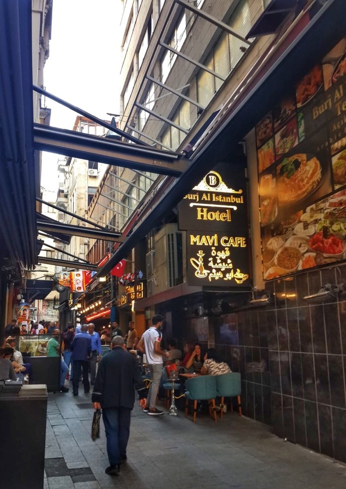 Side street of Istiklal Street with signs in Arabic